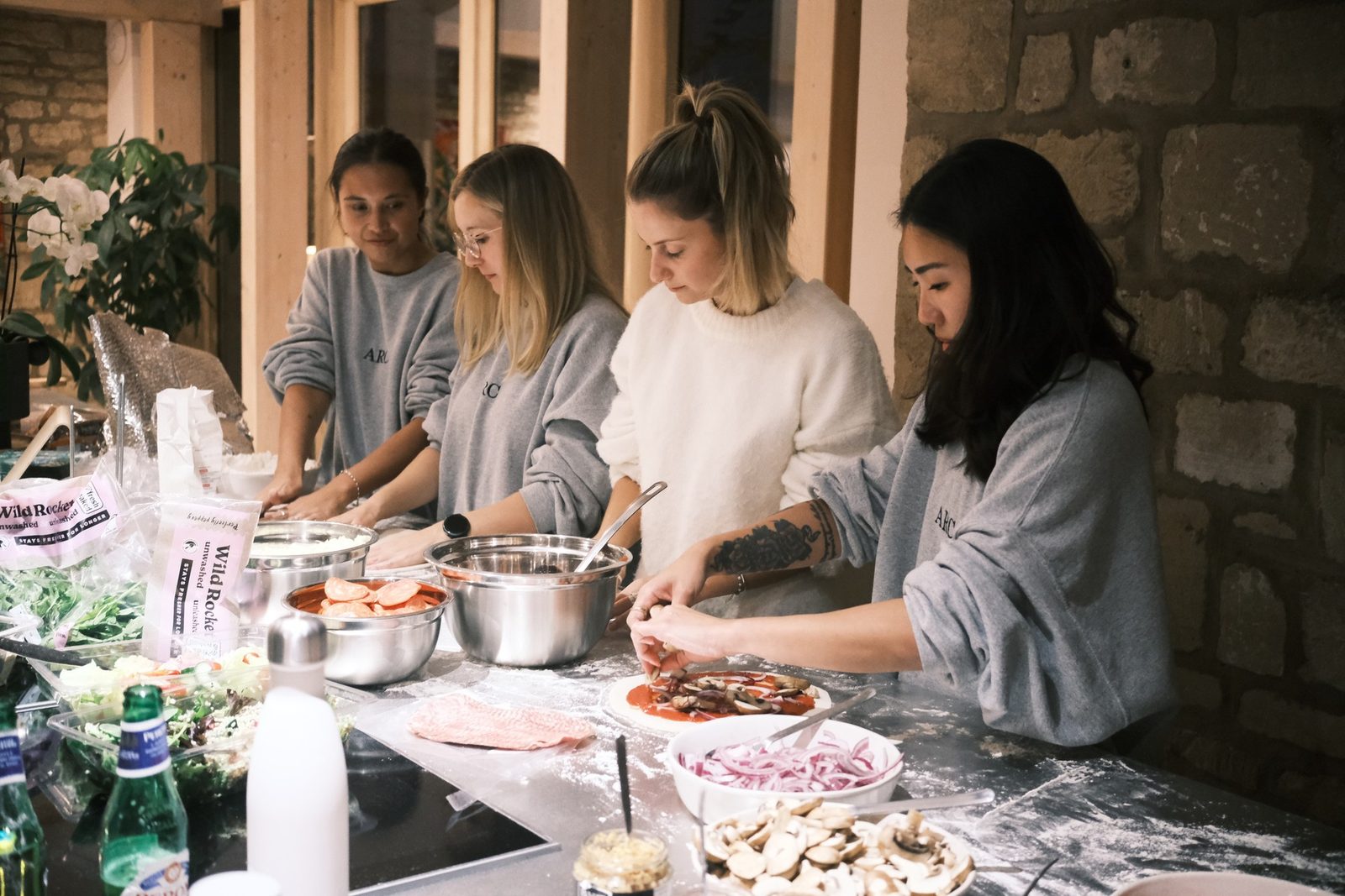 The Picnic team sharing pizza
